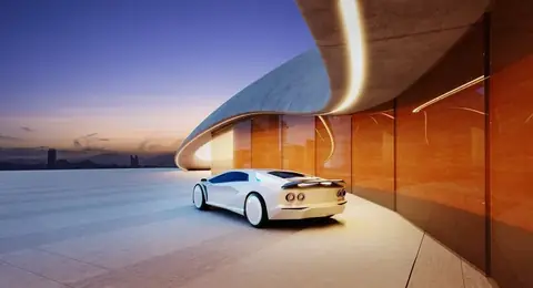 White car outside a modern event venue at dusk